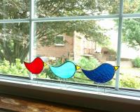 free standing stained glass birds, partridge shaped with beaks and wire legs. measure three inches by four inches.. Available in 6 colors