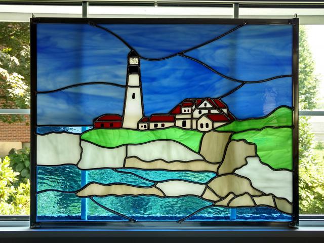 20 in by 15 in stained glass panel depicting the Portland Head Lighthouse in Maine